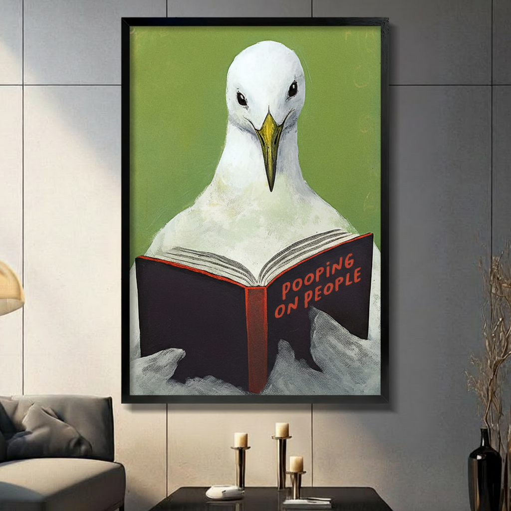 Black framed funny seagull reading Pooping on People book canvas wall art with olive green background displayed in a modern dark gray living room with charcoal sofa, black coffee table and gold candlestick holders