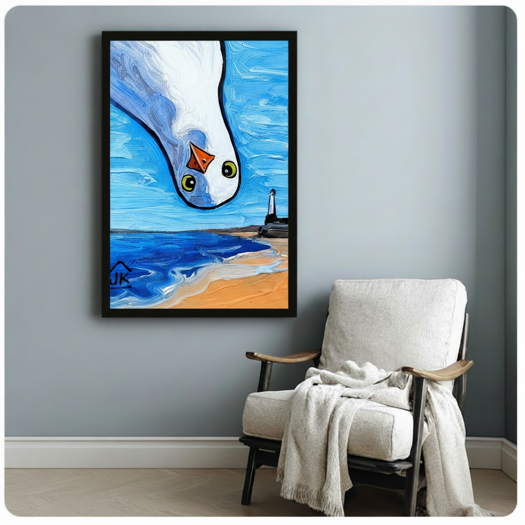 Framed seagull close-up oil painting wall art with lighthouse beach background, displayed on grey wall above accent chair