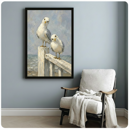 Coastal seagull oil painting black framed canvas art hung on blue-gray wall above white linen armchair with draped blanket