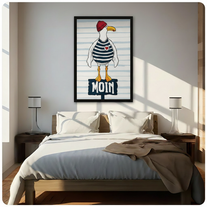 Black framed charming nautical seagull with red knit beanie navy sailor stripes and red heart patch standing on a bold MOIN wooden sign coastal whimsical canvas wall art on blue stripe background hung in warm sunlight above a dark wood bed with white linen bedding