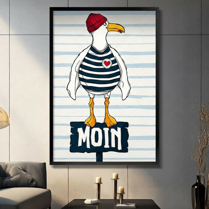 Black framed nautical seagull in red knit beanie navy striped sailor shirt and red heart badge standing on a MOIN wooden sign coastal humor illustration canvas wall art on light blue stripe background displayed in a modern gray living room with dark sofa and metal candlesticks
