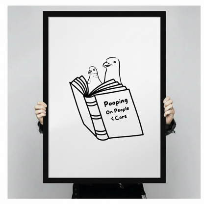 Hand-held close-up of funny seagull Pooping On People and Cars black framed art print, detailed view of minimalist bird line drawing with bold text, humorous animal wall decor