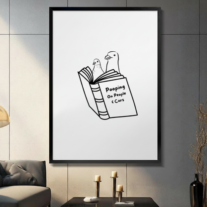 Funny seagull reading Pooping On People and Cars book framed wall art in modern living room, minimalist black and white line art bird humor poster with black frame on gray wall