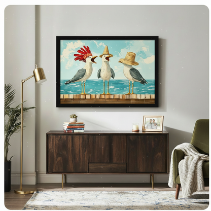 Black framed vibrant whimsical coastal illustration of three noisy seagulls perched on a wooden pier each wearing a different hat a dramatic red feathered headdress a tall yellow sombrero and a casual wide straw hat with beaks open and personalities on full display bright turquoise ocean and sky background funny seagull canvas wall art hung above a dark walnut sideboard with stacked books and a succulent beside a brass floor lamp and olive green armchair