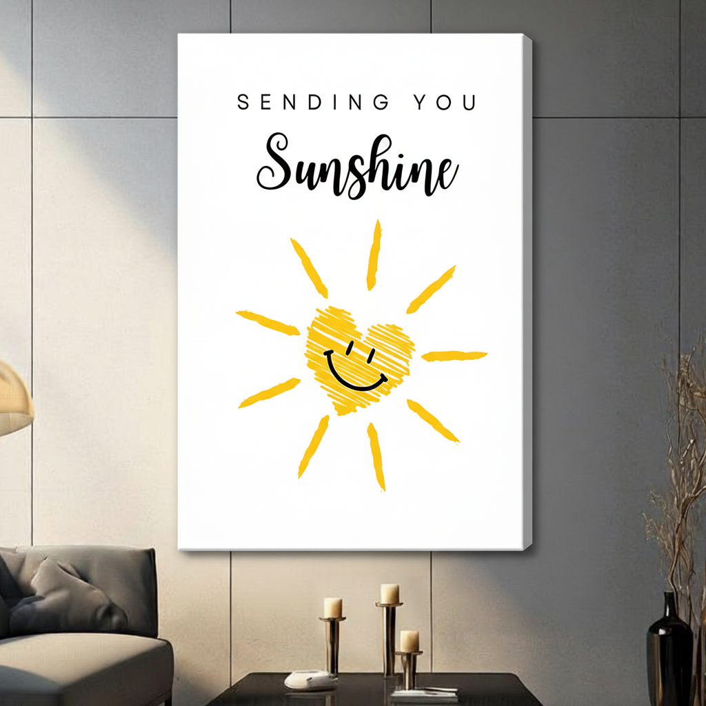 Gallery-wrapped stretched canvas of a smiling yellow sun with a cross-hatched heart center and Sending You Sunshine typography in spaced caps and script lettering, uplifting doodle wall art on white background, hung above a dark sideboard with three candlesticks and a black vase against a gray paneled wall