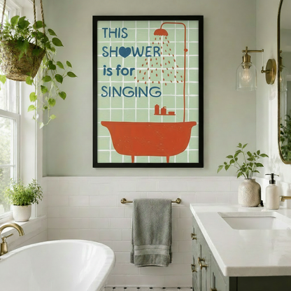 Framed "This Shower is for Singing" retro canvas art with orange bathtub on mint tile background, displayed in a bright modern bathroom with a freestanding tub, hanging plants, and gold fixtures
