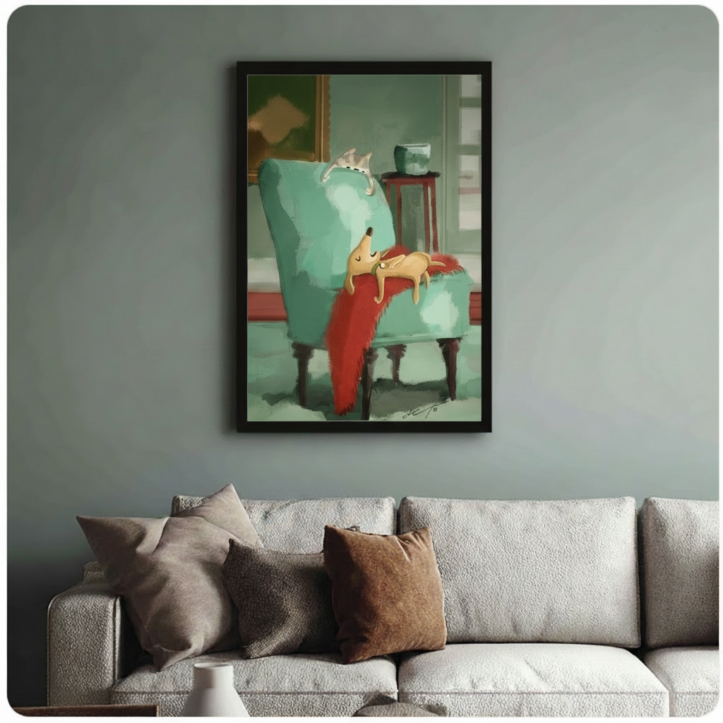 Sleeping dog and cat art print in black frame hanging above a sage green sofa in a cozy living room