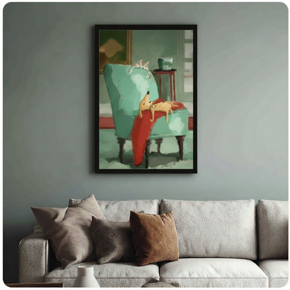 Sleeping dog and cat art print in black frame hanging above a sage green sofa in a cozy living room