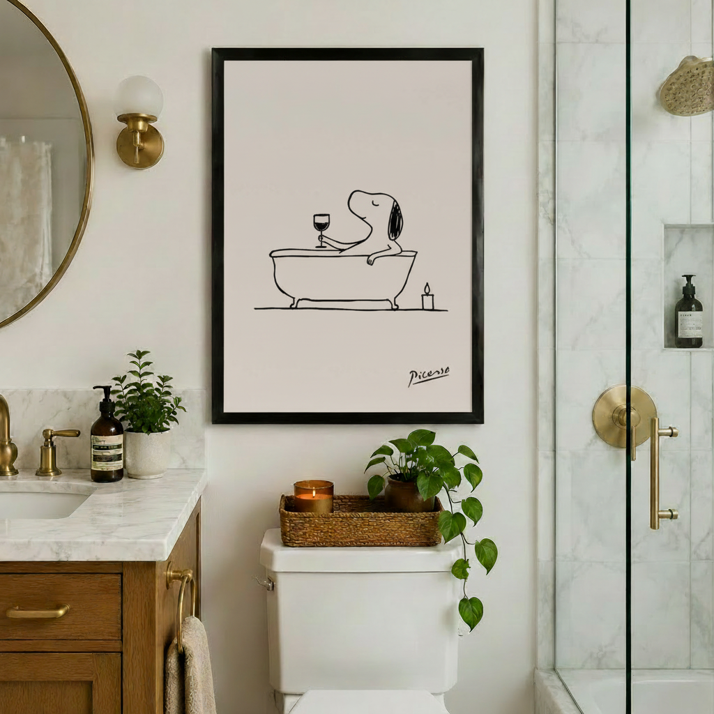 Snoopy bathtub wine art framed print above toilet in marble bathroom - humorous dog line art wall decor with brass fixtures