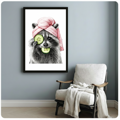 Spa raccoon with pink hair towel and cucumber eye treatment in a black frame on a blue-grey wall beside a wooden armchair draped with a white throw blanket, whimsical animal self-care wall decor for a reading nook