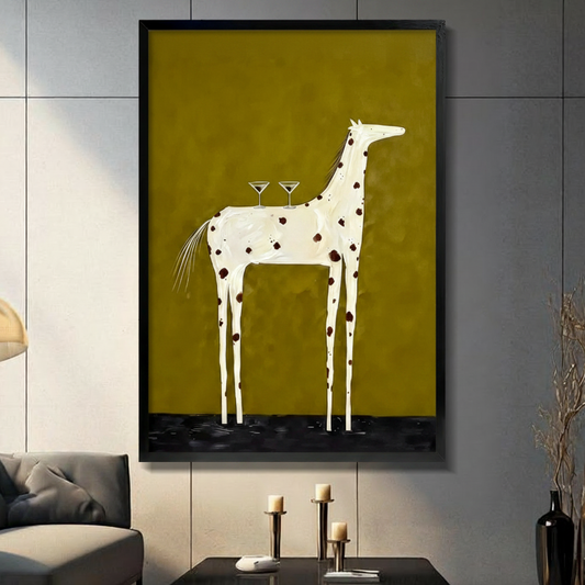 Minimalist surrealist oil painting of a slender white horse with dark brown spots standing sideways on a black liquid floor with two martini glasses balanced on its back against a flat olive green background quirky horse bar wall art framed print in a living room with light gray large tile panel wall dark sofa candle holders and black vase