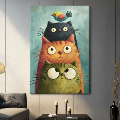 Whimsical impasto oil painting of three plump stacked cats in olive green orange and black with oversized expressive eyes and a colorful bird perched on the topmost cat against a teal brushstroke background cheerful cat wall art stretched canvas in a living room with dark gray panel wall dark sofa and black vase