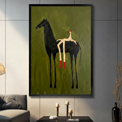 Surrealist naive oil painting of an elongated stick figure rider with a red round head and red boots straddling a tall black horse against a heavily textured olive green background with gold scratch marks quirky equestrian wall art framed print in a living room with dark gray panel wall dark sofa and black vase