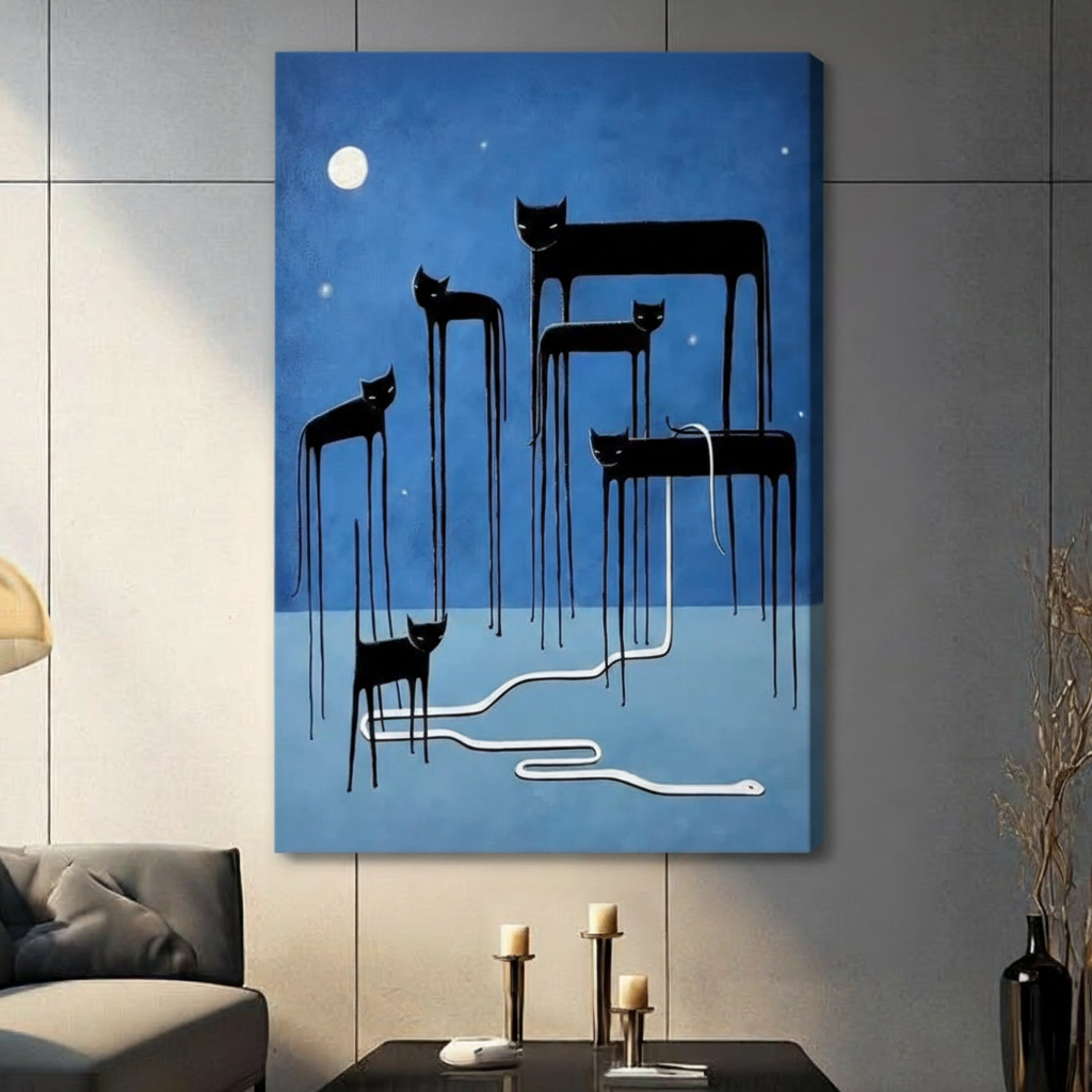 Stretched canvas wall art featuring five surreal elongated black cats with melting dripping legs under a luminous full moon and scattered stars on a moody cobalt blue background, with a sinuous white snake winding across the ground, hung on a gray tile wall beside a modern charcoal sofa