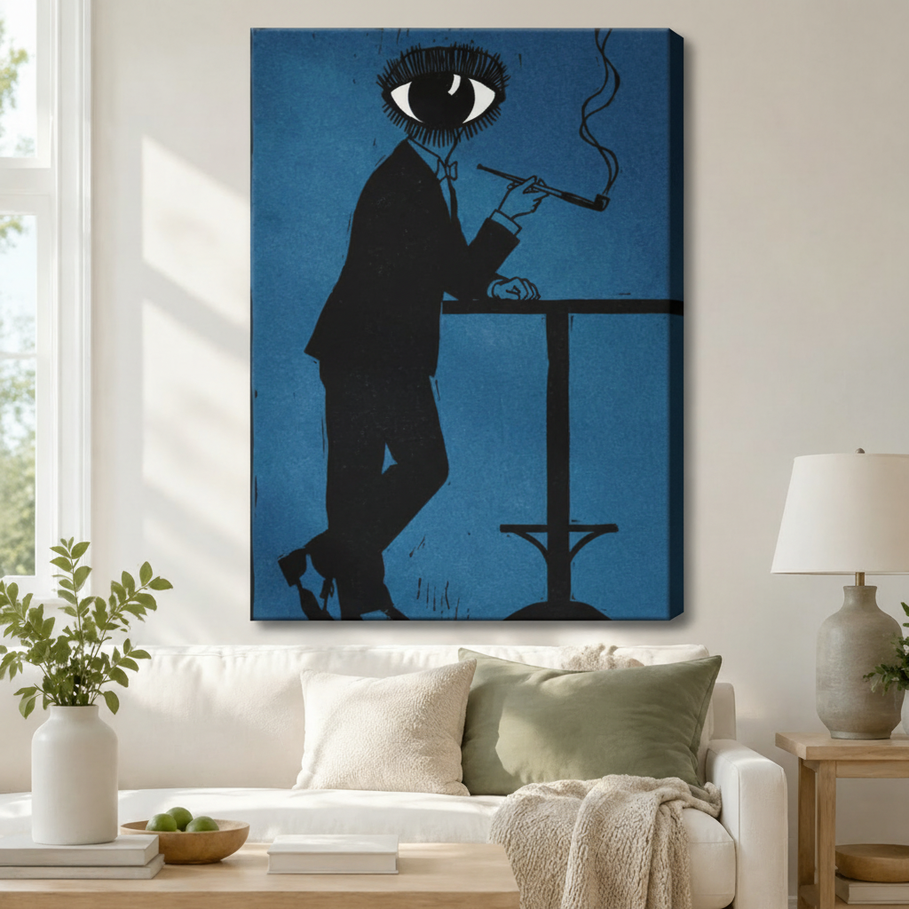 Surrealist eye-head figure in black suit smoking pipe gallery wrap canvas art in deep blue above a white sofa with sage green cushions, a knit throw blanket, and a ceramic table lamp