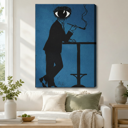 Surrealist eye-head figure in black suit smoking pipe gallery wrap canvas art in deep blue above a white sofa with sage green cushions, a knit throw blanket, and a ceramic table lamp