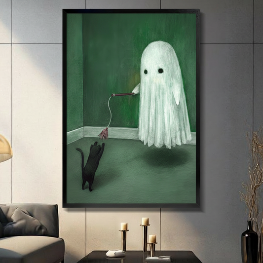 Framed surreal whimsical oil painting fluffy white ghost with hollow black eyes floating in deep emerald green room holding a wooden cat wand toy on string while small black cat stands on hind legs reaching upward to bat at the tassel on sage green floor with soft shadow beneath ghost on dark grey tile wall in modern living room with charcoal sofa and brass candlestick holders on coffee table - funny ghost playing black cat green wall art for contemporary home decor