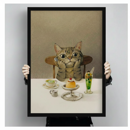 Tabby cat with big eyes sitting before cafe desserts and drinks, premium framed canvas art print held up showing full artwork detail
