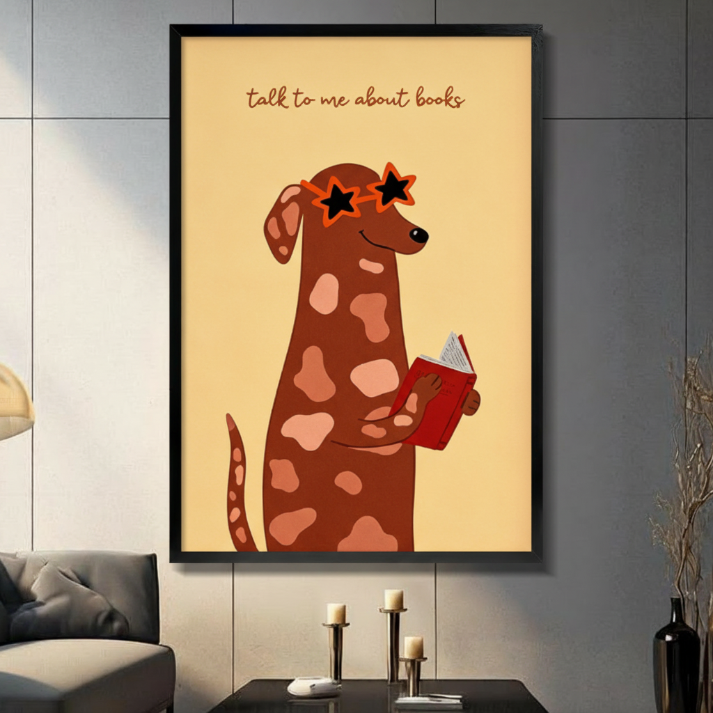 Cute dog reading book with star sunglasses framed wall art in black frame on dark gray wall above console table, whimsical bookworm illustration on cream yellow background for living room decor