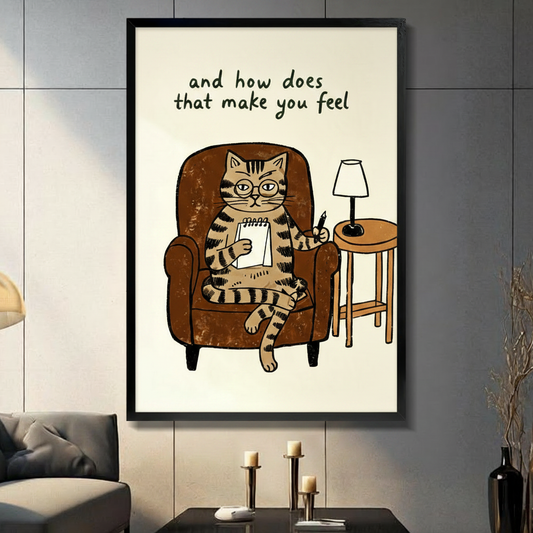 Framed funny therapist cat wall art print with "and how does that make you feel" quote, hung on grey tile wall in modern living room