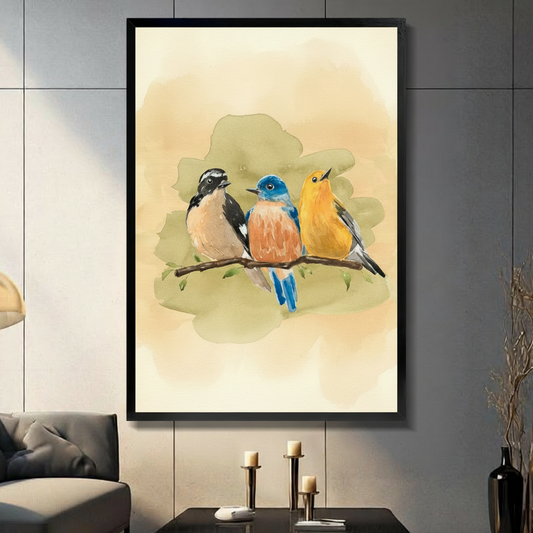 Soft watercolor painting of three birds perched together on a thin branch featuring a black and white chickadee with a dark cap white cheek patch and warm buff belly on the left a vivid eastern bluebird with a bright blue head wings and tail and a rich orange-red breast in the center and a golden yellow warbler or goldfinch with gray wing accents on the right set against a warm cream and soft olive green watercolor wash background with small green leaves nature bird trio art framed print displayed in a livi