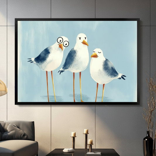 Three chubby seagulls with funny expressions one wearing round glasses on a soft blue background funny coastal seagull wall art framed print in a living room with gray sofa candle holders and black vase