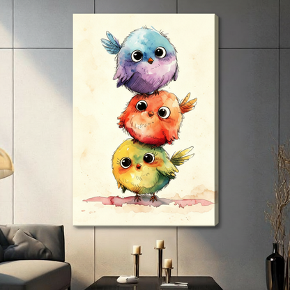 Whimsical watercolor illustration of three round fluffy birds stacked on top of each other in blue purple red orange and yellow green with big black eyes on a cream background cute bird stack wall art stretched canvas in living room with dark gray panel wall and dark sofa