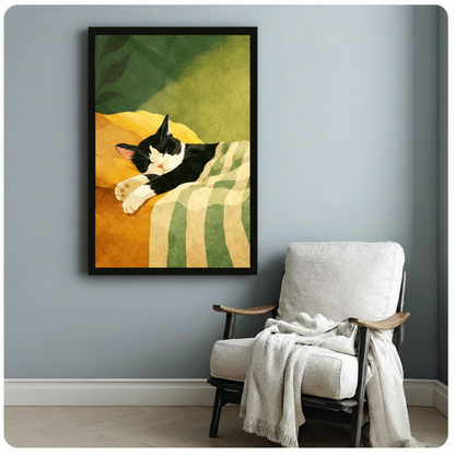 Black framed charming tuxedo cat dozing on a mustard yellow cushion with a green striped blanket and lush botanical leaf backdrop minimalist flat illustration canvas print hung on a soft blue-gray wall beside a white linen wood armchair with a draped cream knit throw