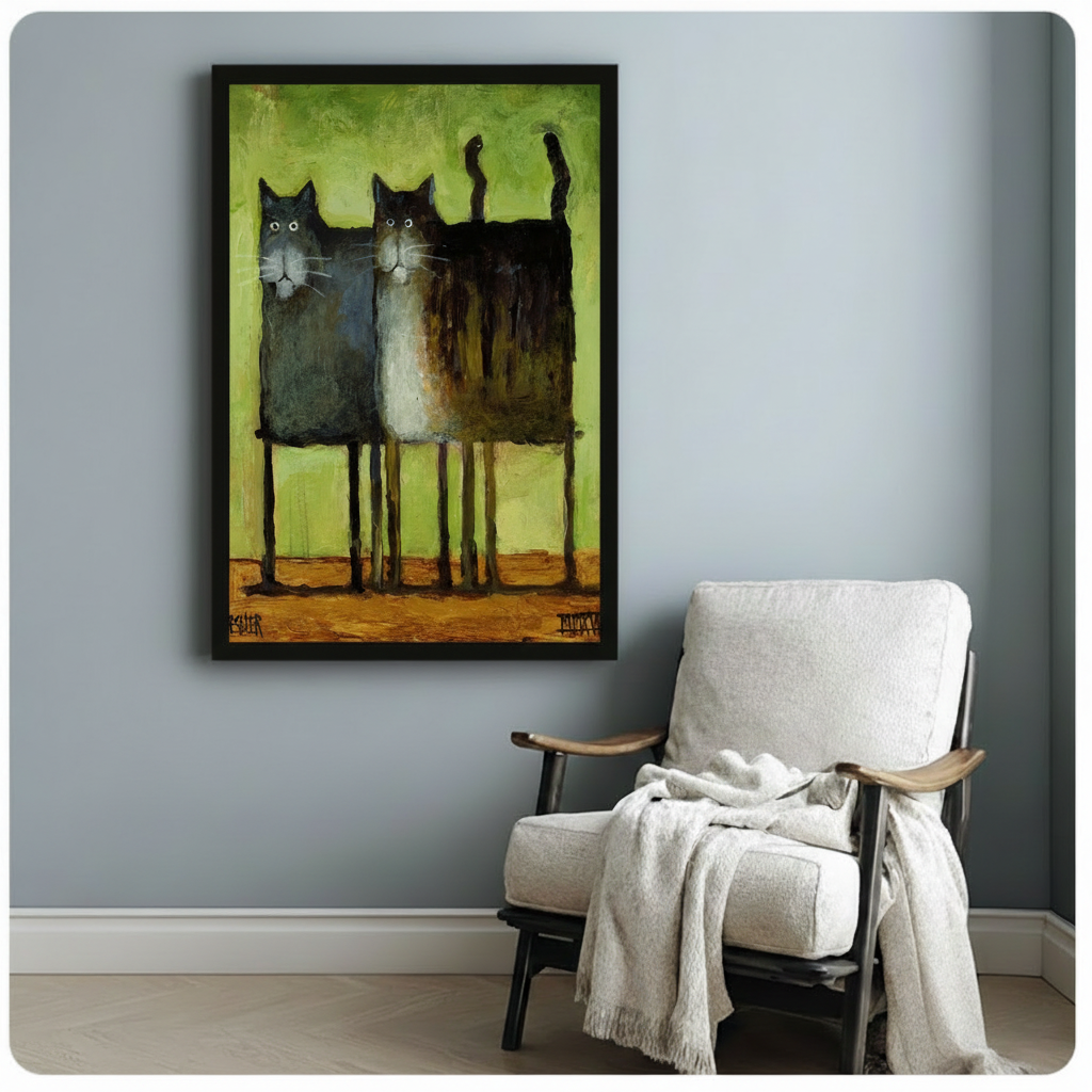 Black framed two cats oil painting print on a light blue-grey wall beside a linen armchair with a cosy throw blanket