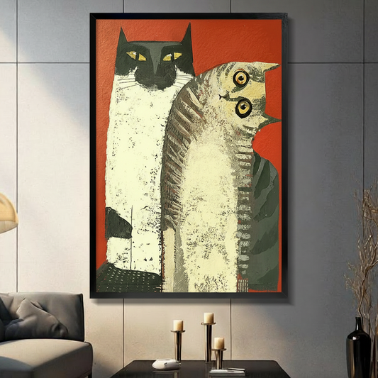 Framed retro pop art print of two cats on bold red background, displayed in a dark modern living room with candlestick decor