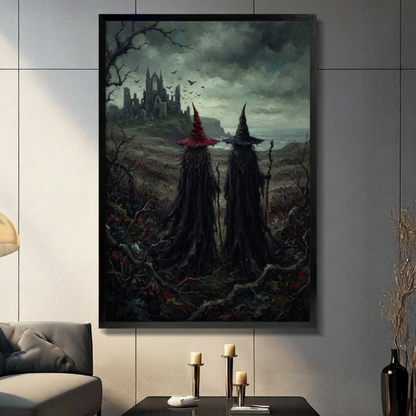 Two cloaked witches in red and black hats standing in wild moor facing ruined gothic castle with bats in stormy sky, dark fantasy impasto canvas wall art in black float frame on gray tile wall above console table with pillar candles in modern American living room