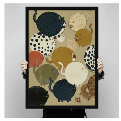 Hand-held close-up of Japanese ukiyo-e chubby cats black framed art print, detailed view of colorful round cats with polka dot pattern and kanji seal