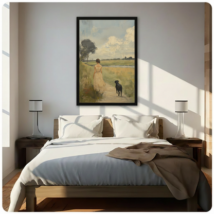 Framed vintage landscape canvas art of a woman and black Labrador walking a sunlit field path, hung above a bed in a bright minimalist bedroom