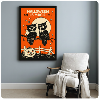 Two owls with moon and Halloween lettering in framed canvas beside a light armchair.