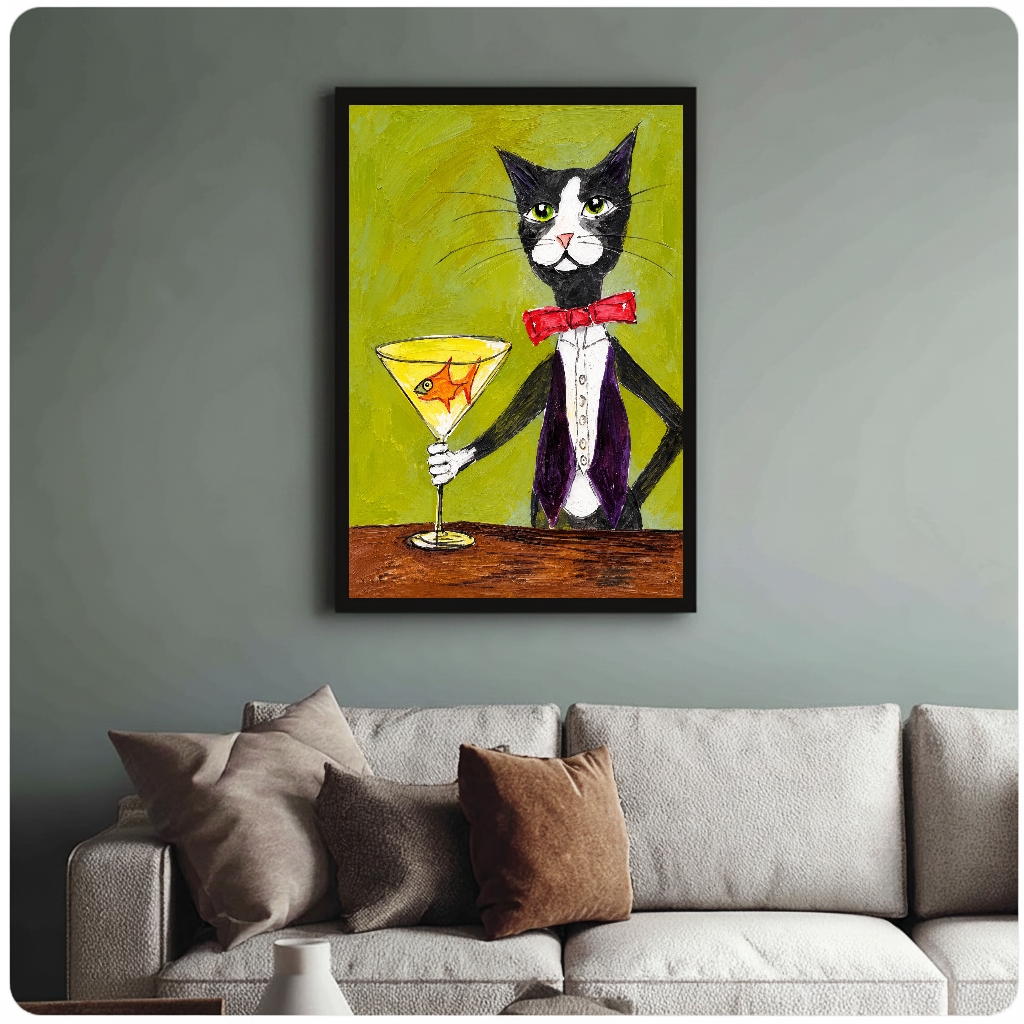 Tuxedo cat holding a goldfish martini glass in framed canvas above a light living room sofa.