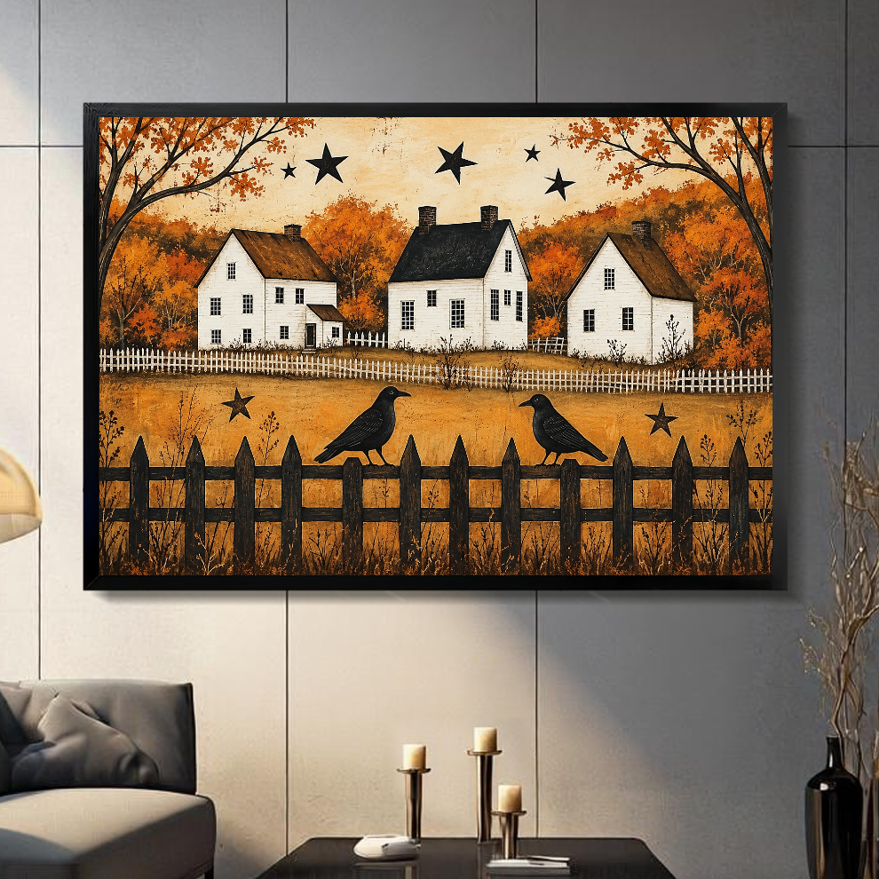 Black framed autumn crows and cottages canvas artwork displayed on a gray wall in a neutral room.