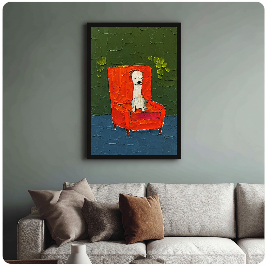 Framed white puppy in red chair wall art displayed above a neutral sofa with soft cushions.