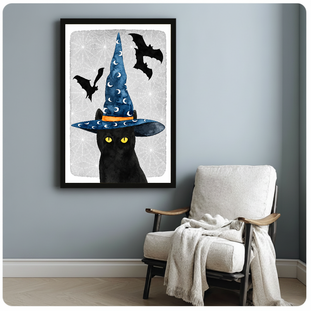 Framed witch cat canvas artwork displayed beside a reading chair with a soft blanket.
