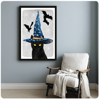 Framed witch cat canvas artwork displayed beside a reading chair with a soft blanket.
