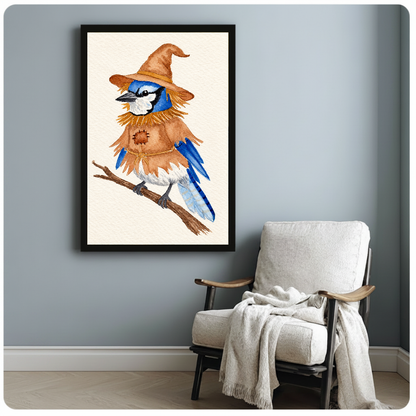 Framed scarecrow bird canvas artwork displayed beside a reading chair with a soft blanket.