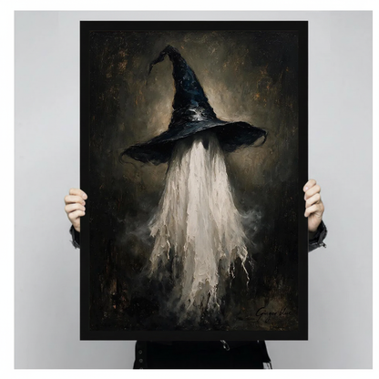 A person holds framed witch hat ghost canvas artwork to demonstrate its portrait proportions.
