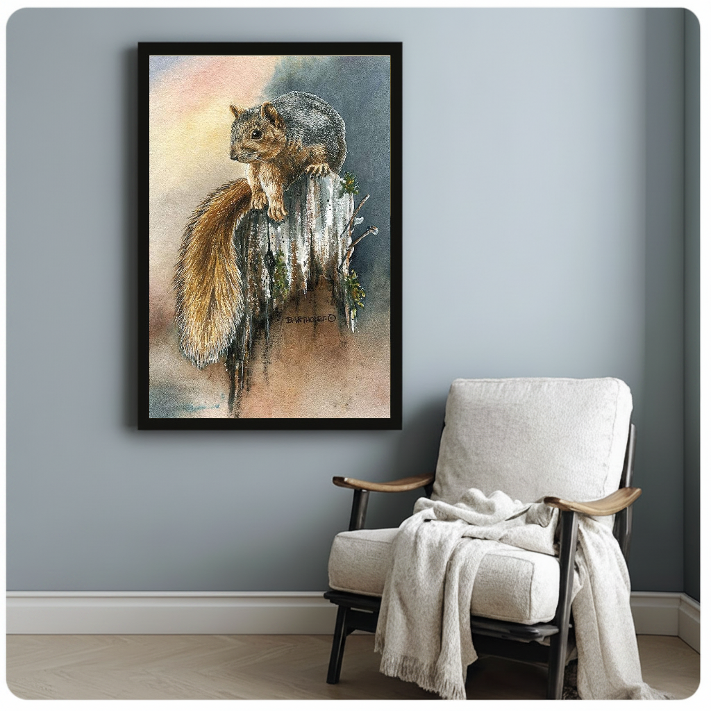 Framed woodland squirrel watercolor beside a pale reading chair against a blue-gray wall.