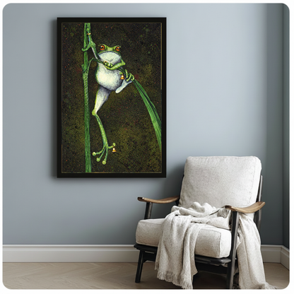 Framed artwork of a frog holding bells among reeds beside a pale reading chair against a gray wall.