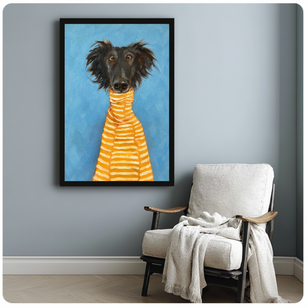 Framed artwork of a black dog in a striped sweater beside a pale reading chair against a gray wall.