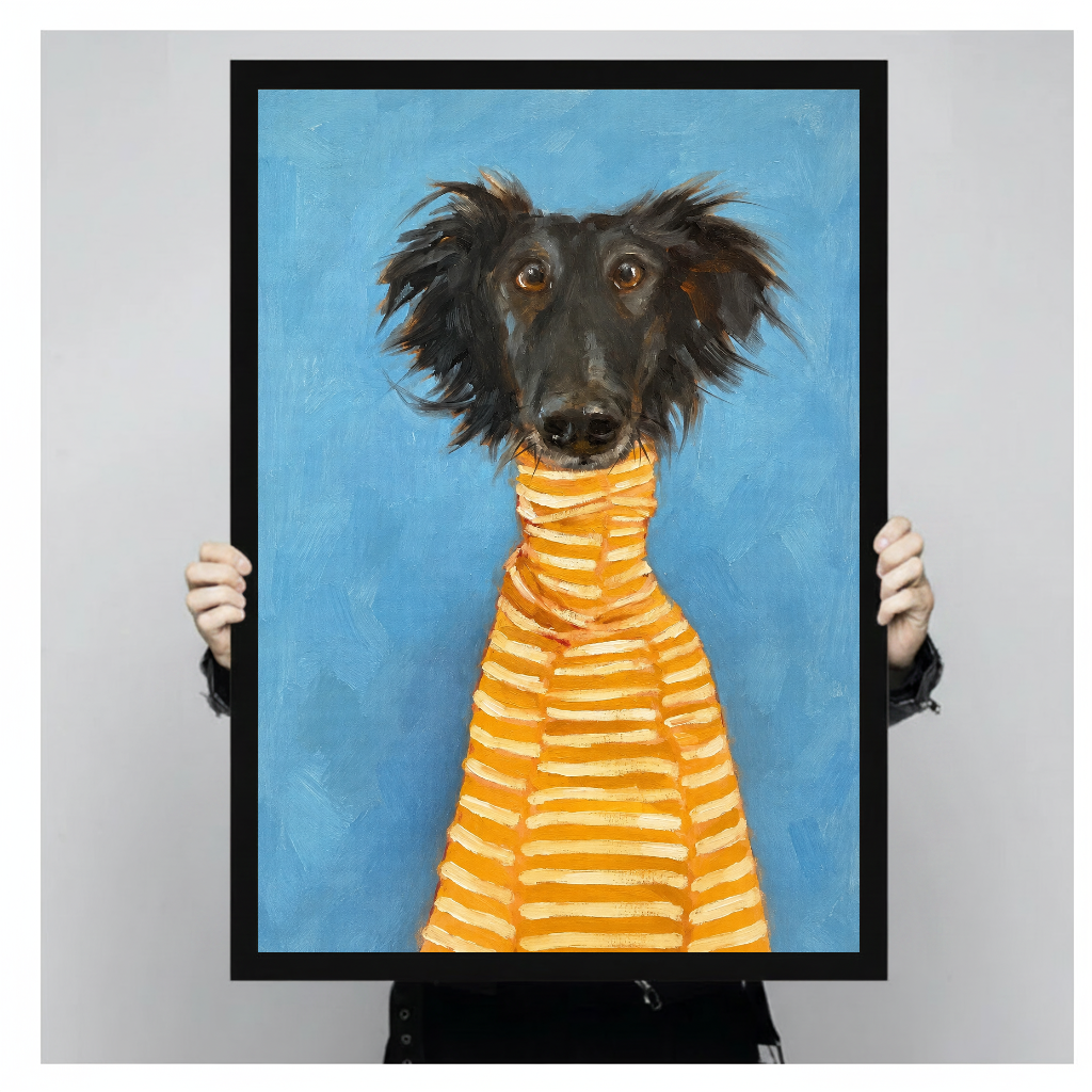 Framed artwork of a black dog in a striped sweater held by a person against a pale backdrop.