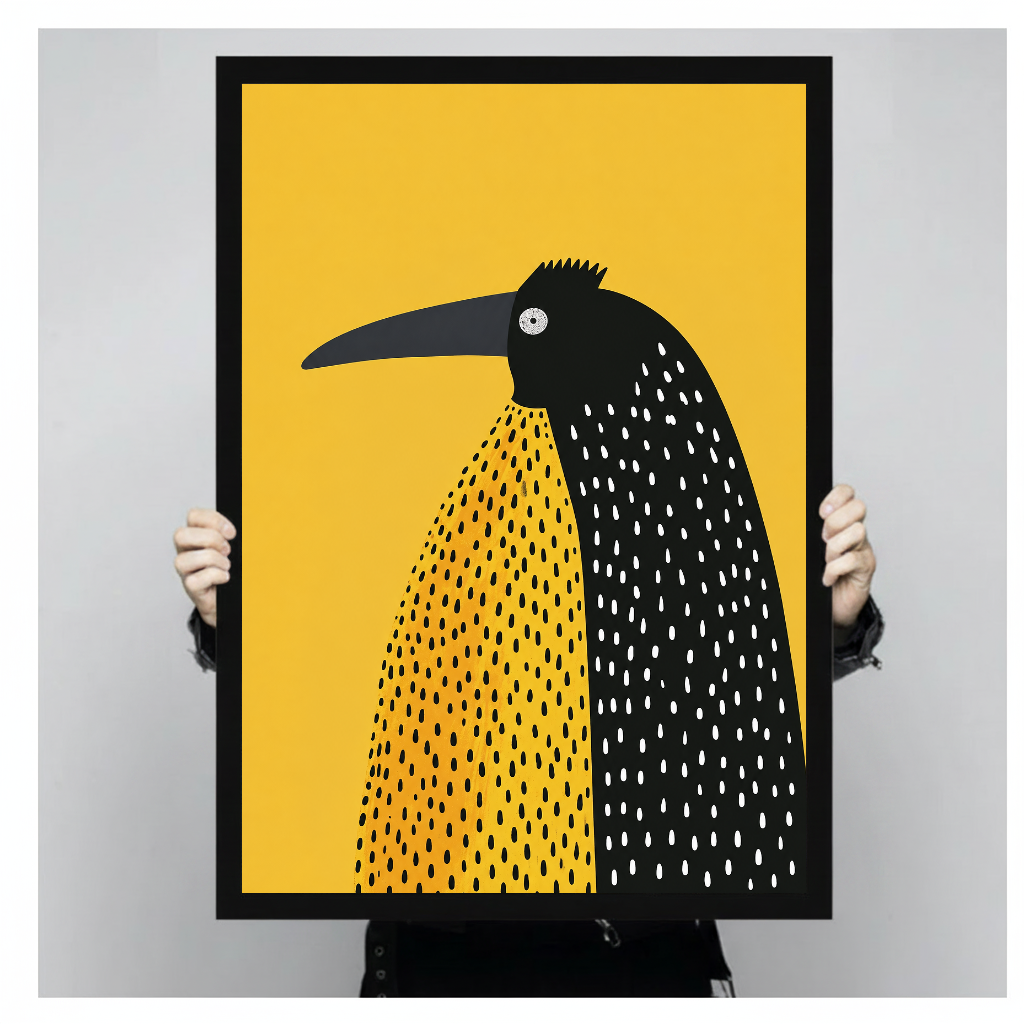 Framed artwork of a spotted black bird on yellow held by a person against a pale backdrop.