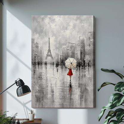 Stretched canvas depicting a red dressed woman beneath an umbrella displayed on a bright desk with a lamp.