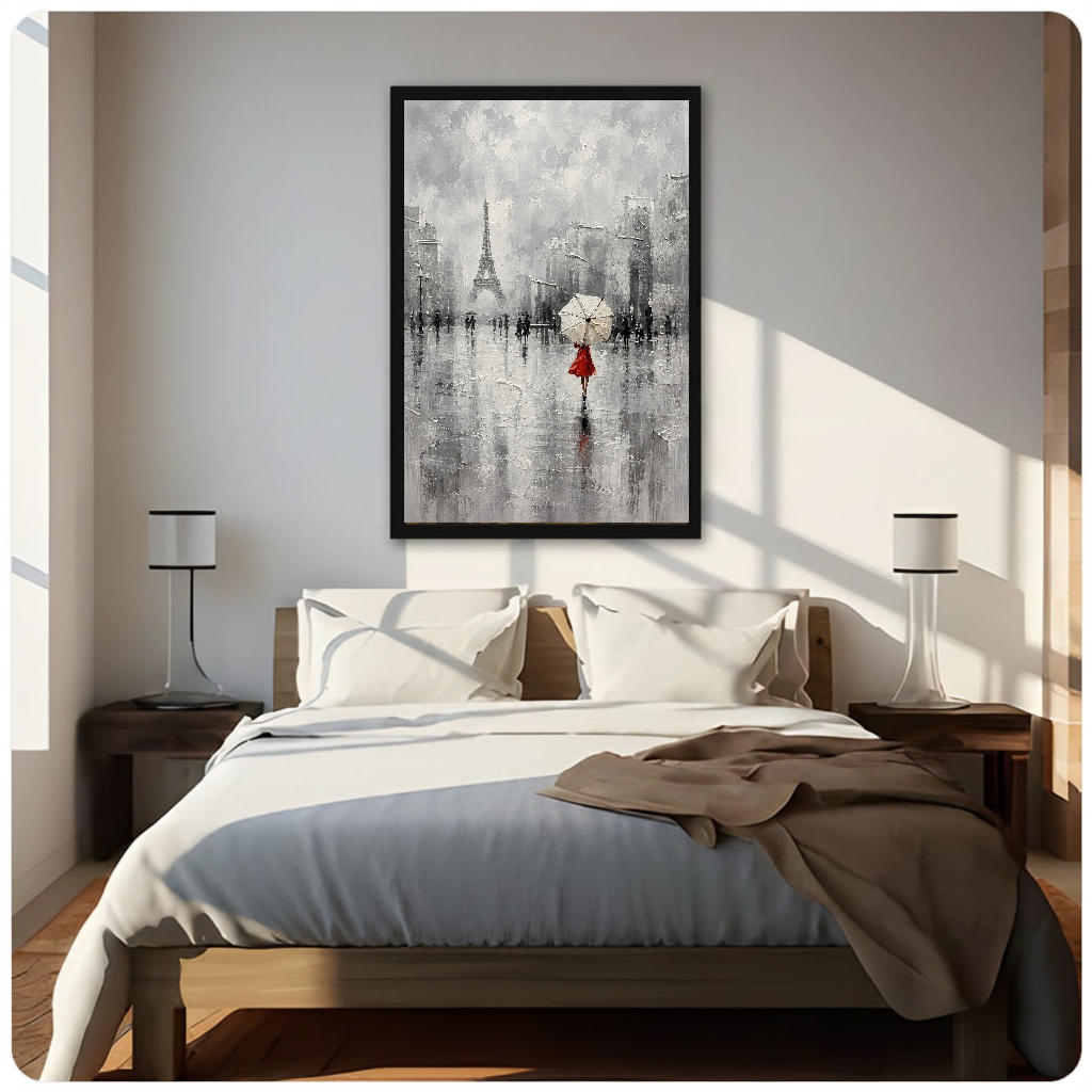 Framed artwork of a red dressed woman beneath an umbrella above a neutral bed between two bedside lamps.
