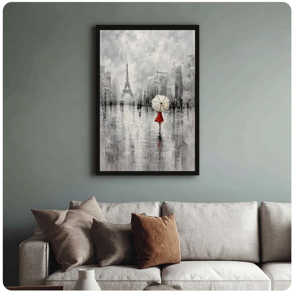 Framed artwork of a red dressed woman beneath an umbrella above a sofa with muted cushions.