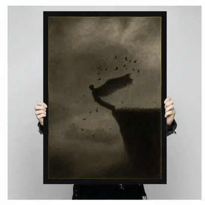 Person holding a black framed portrait canvas depicting winged figure above a cliff.